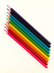 Colored pencils on a white background.