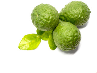 close up group of fresh bergamot with green leaves isolated on white background. benefits of bergamot for beauty and health concept