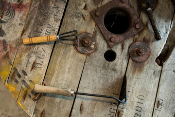 Set of old working tools over rough wooden background