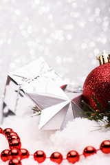 Christmas composition of Christmas tree toys on a silver background