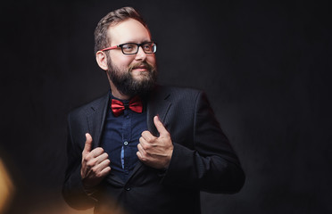 A man in eyeglasses and bow tie.