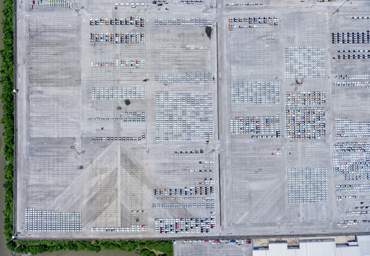 Large Empty Car Factory Car Park, Aerial View Top Down.