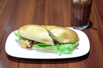 beef burger with lettuce and tomato