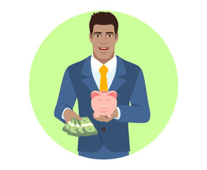 Businessman with money and piggy bank
