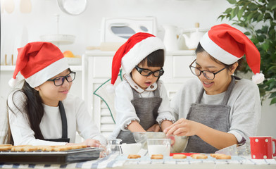 Family baking cookies in the kitchen.