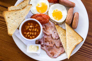 Egg and Toast - classical english breakfast with egg and ham