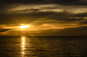 Landscape with sea and cloudy under the sky with sunset in the evening.