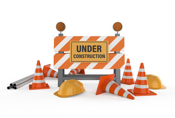 under construction sign with barrier and cones