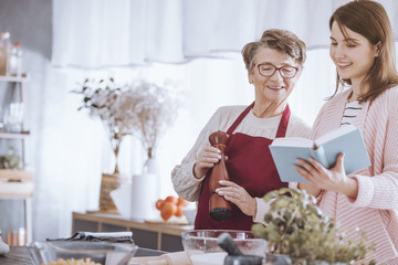 Young woman holding cookbook