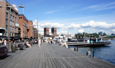 Fototapeta na wymiar View of city hall (radhus), wooden pier, sunny day, Oslo, Norway