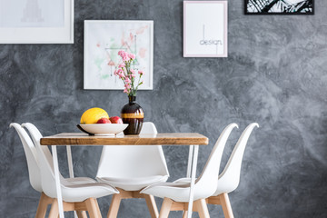 Dining table against concrete wall
