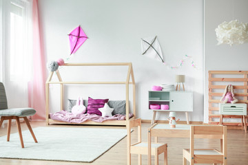 Pink kite in child's bedroom