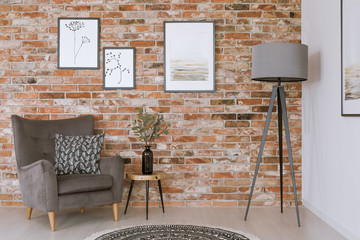 Gray furniture against brick wall