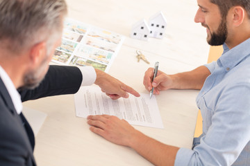 Buyer signing contract with developer
