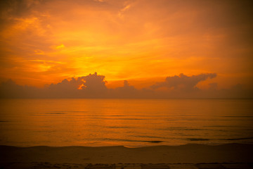 Golden sun set in tropical hot summer beach in thailand, golden special effect.