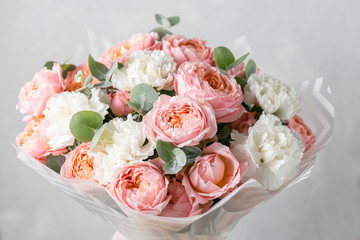 Bouquet of mixed flowers in glass vase. copy space