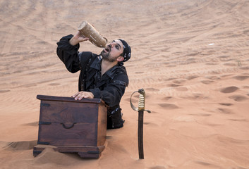 black pirate in a desert with treasure box