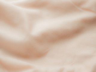 Wrinkled fabric texture color cappuccino Copy space