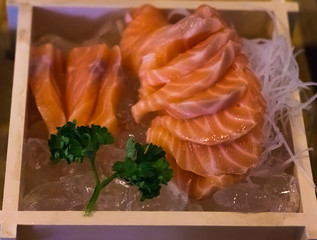 Raw salmon fish in Japanese restaurants. Warm light