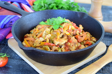 Stew from chicken fillet with zucchini paprika, onions, olive oil, spices.