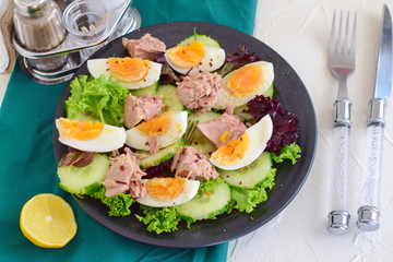 Salad with cucumber, eggs and tuna with olive oil, lemon and honey dressing.