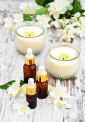 Obraz na płótnie Canvas Massage oils and jasmine flowers