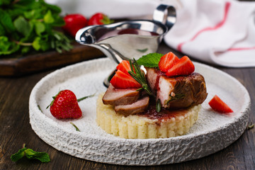 Grilled veal steak with couscous and strawberry sauce. Holidays dinner concept. Copy space