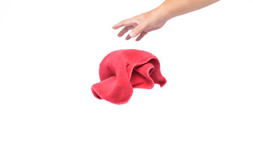 The man's hand is drop or releasing  the red rag on white background or isolated