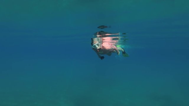  A woman is floating on the surface of water
