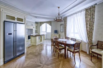 Modern design white kitchen in a spacious apartment.