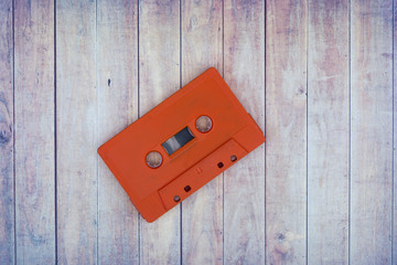Old cassette tapes with a wooden background
