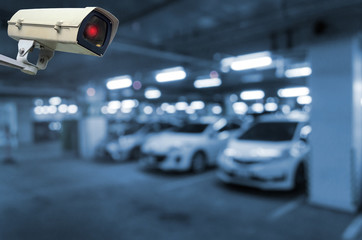 CCTV, security indoor camera system operating in underground car parking garage area, intelligent...