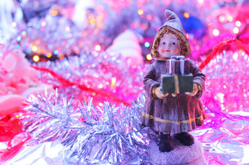 Christmas doll background among decorations