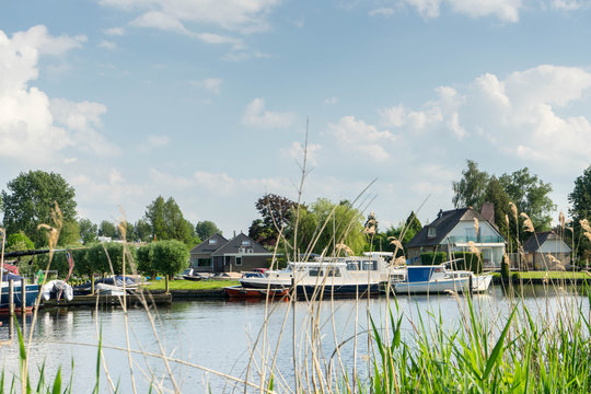 Boats and Houses in Zwartsluis, near the Weerribben-Wieden National Park, near Giethoorn, Netherlands