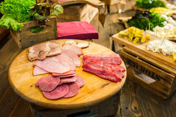 meat sliced with vegetables on a buffet table
