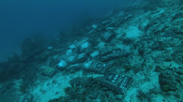 Garbage bags thrown to the bottom next to one of the tropical islands of the Indian Ocean, MALDIVES
