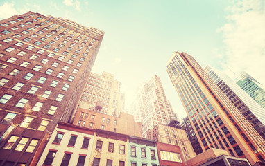 Fototapeta na wymiar Manhattan buildings at sunset, vintage stylized picture, USA.