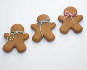 Happy New Year and Merry Christmas gingerbread on  white background. Christmas baking. Making gingerbread christmas cookies. Christmas concept.