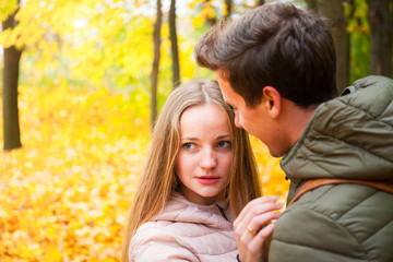 Fototapeta premium Couple in love in the autumn forest