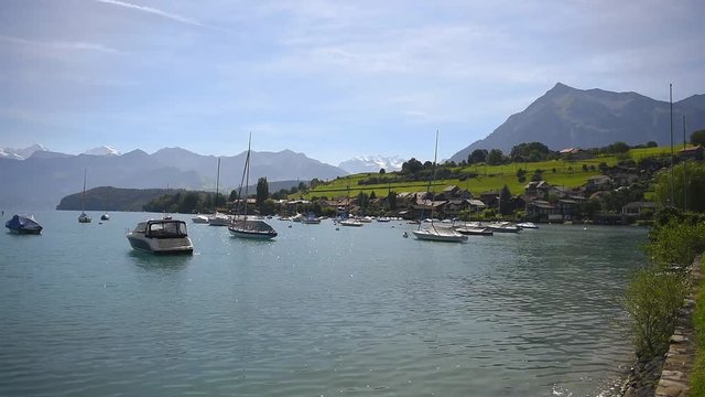 Boats floating on lake Thun Bernese Oberland Switzerland 