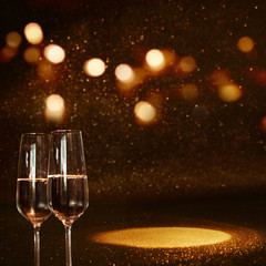 Golden bokeh background with champagne and light spot