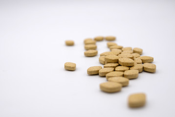 Group of light brown diamond shape organic vitamins