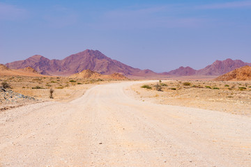 Road trip in the Namib desert, Namib Naukluft National Park, travel destination in Namibia. Travel adventures in Africa.