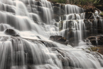 Fototapeta na wymiar Water cascading down a series of waterfalls in British Columbia