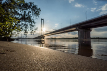 Reflection of a bridge on calm river