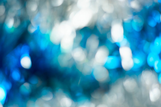 Abstract background with white and blue bokeh