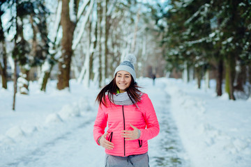 Happy woman running in winter