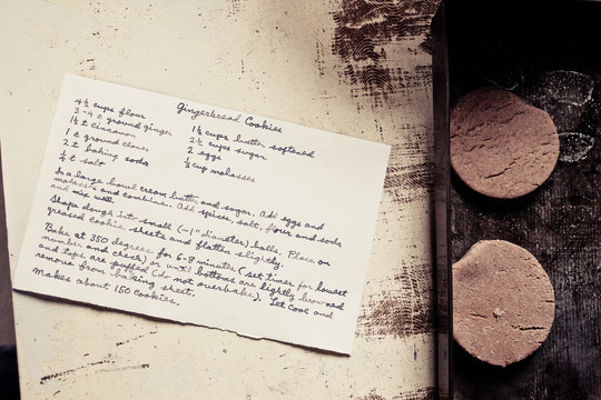 Gingerbread Cookies On A Baking Sheet With Handwritten Recipe Card.