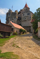 Fototapeta na wymiar Pernstejn Castle is a castle on a rock above the village of Nedvedice, South Moravian Region, Czech Republic