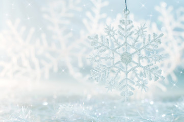 Snowflake on a blue festive background. Beautiful Christmas background
